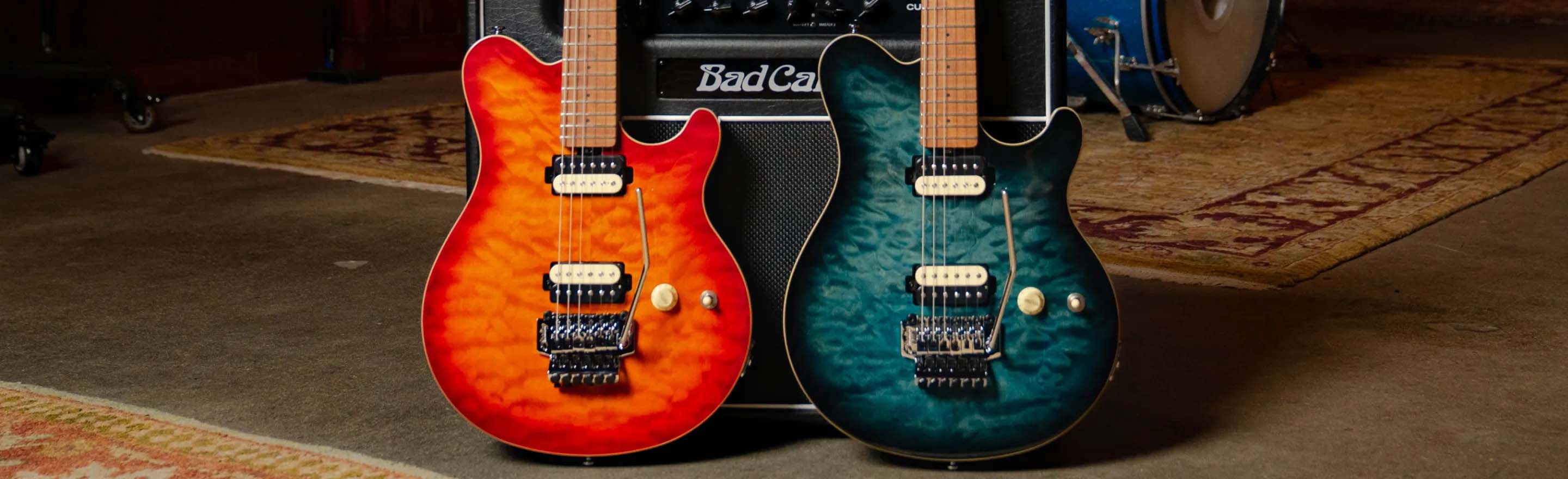 The Axis Flame Maple guitars in Trans Gold and Neptune Blue.