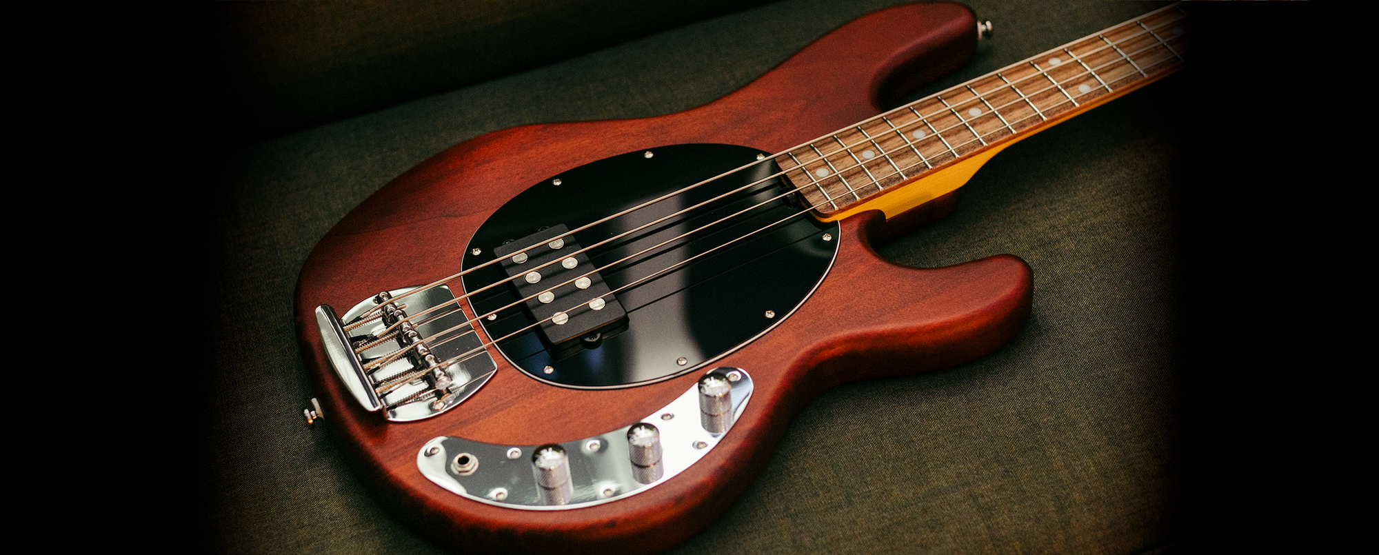 Closeup details of the StingRay Ray4HH bass in Candy Apple Red.